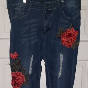 Floral embroidered slightly distressed jeans.